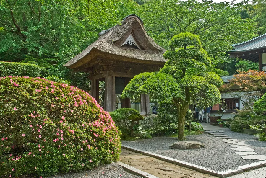 The bell tower with its straw roof of Hokokuji Belltower in Kamakura