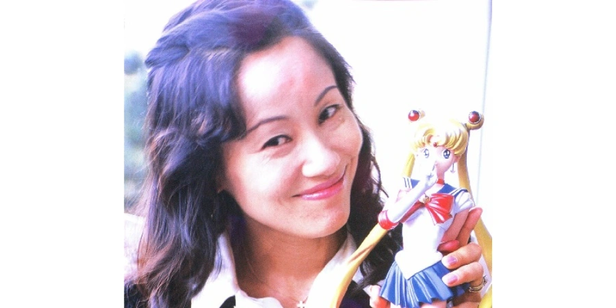 Naoko Tekeuchi with a Sailor Moon figurine