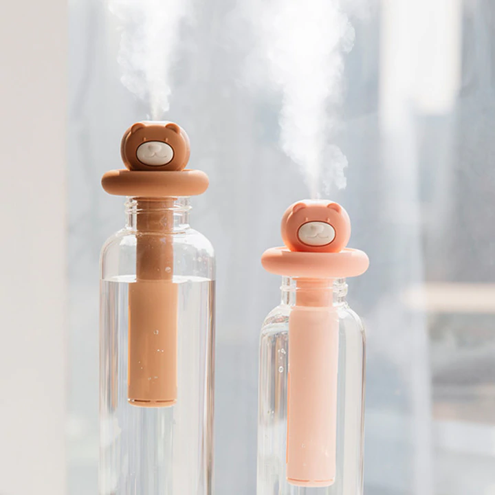 When the weather gets warm you'll wanna check out our adorable Cuddly Bear Air Humidifiers. You can choose to just go for the cute humidifier stick, which you can simply dunk in a small bottle and some freshwater to just cool down your immediate space, or go for gold and get the fitted bottle, matching the colour. This is perfect for the bedroom, but especially around your laptop.
DimensionsHumidifier stick: Diameter 3cm | Length 10cm
Glass: Diameter 6cm | Length 16cm | Capacity 1LWant an extra boost? You can fill these air diffusers with mineral water of your choice, and give yourself a refreshing and moisturising facial too! Wakes you and your skin up all at once. A must-have Home Gadget in 2022!
 