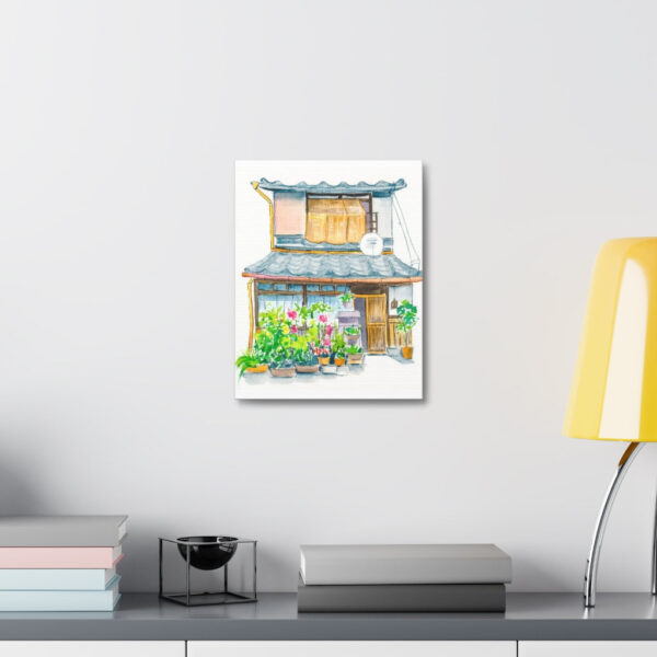 Vibrant watercolor painting of Garden Machiya displayed above a study desk
