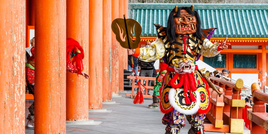 Person dressed up as an oni in a temple to celebrate Setsubun in Japan