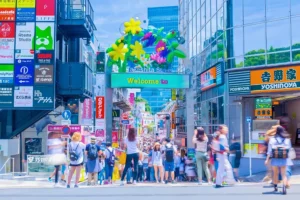 takeshita street in harajuku tokyo filled with shoppers colorful fashion stores kawaii culture and vibrant japanese street fashion scene.