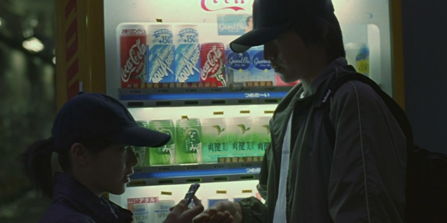 meeting in front of a japanese vending machine