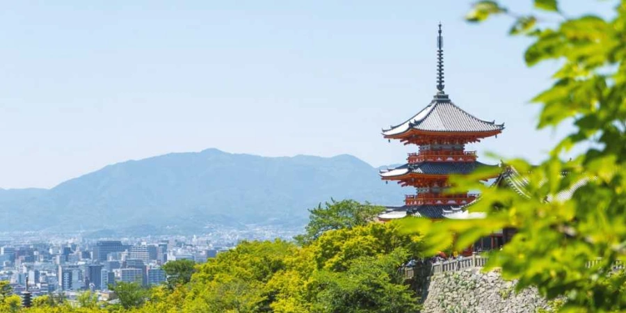 Kiyomizu-dera Temple with green trees and buildings