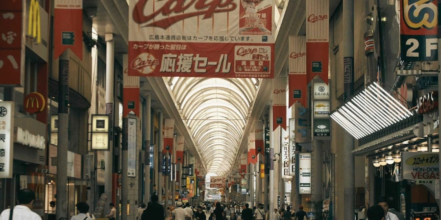 Busy people walking down the Hondori Street, full of shops