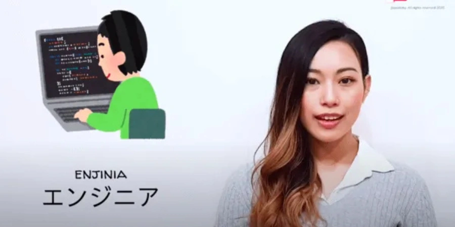 A teacher teaching "engineer" in Japanese