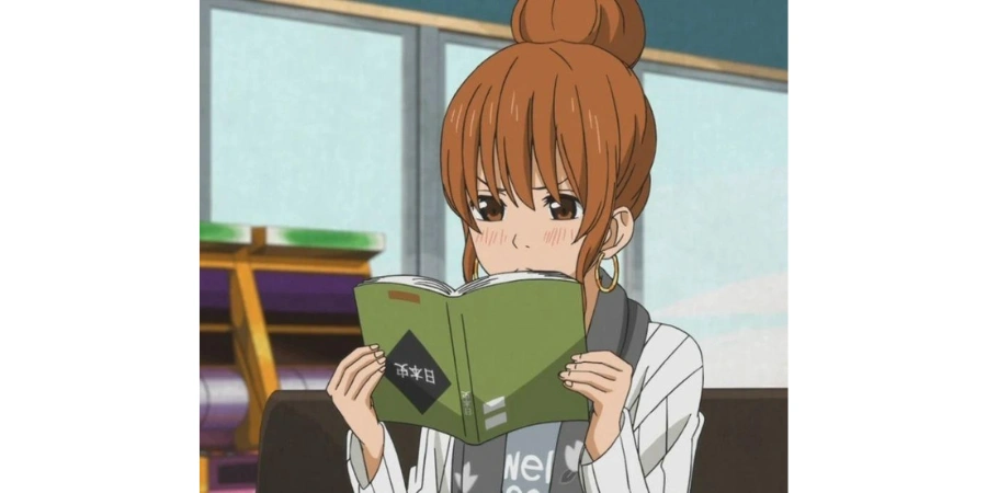 Japanese Girl reading Japanese book upside down