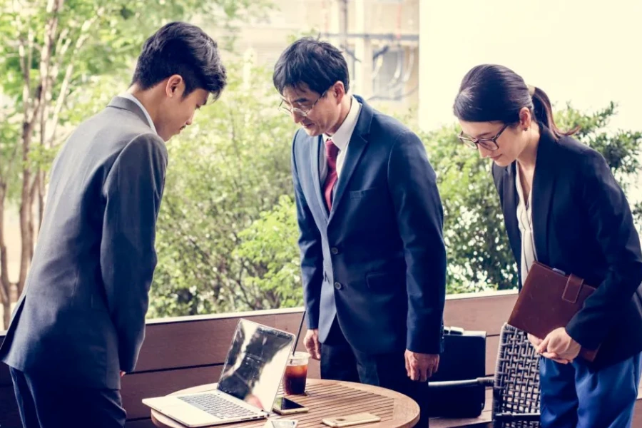 Japanese employees showing respect by bowing to each other
