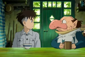 scene from the boy and the heron showing mahito maki with the mysterious grey heron in a studio ghibli film about grief war and emotional growth.