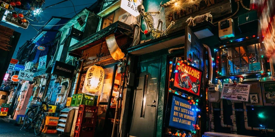 Busy street with neon lights at Golden Gai