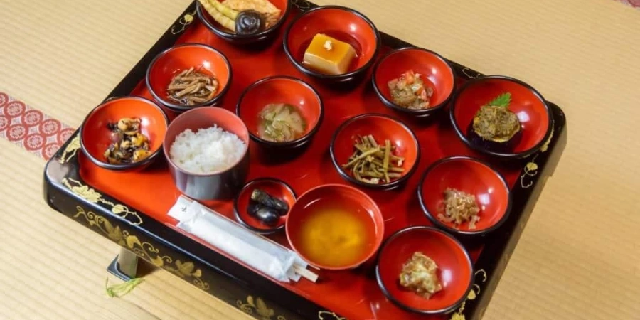 A Japanese meal with a variety of dishes and sides
