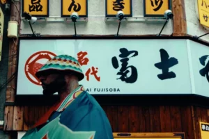A person standing outside the Fujisoba store