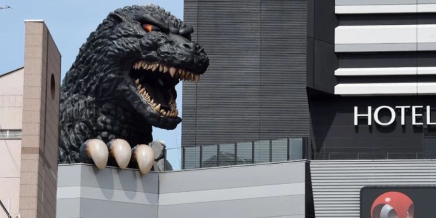 Godzilla popping out from the building