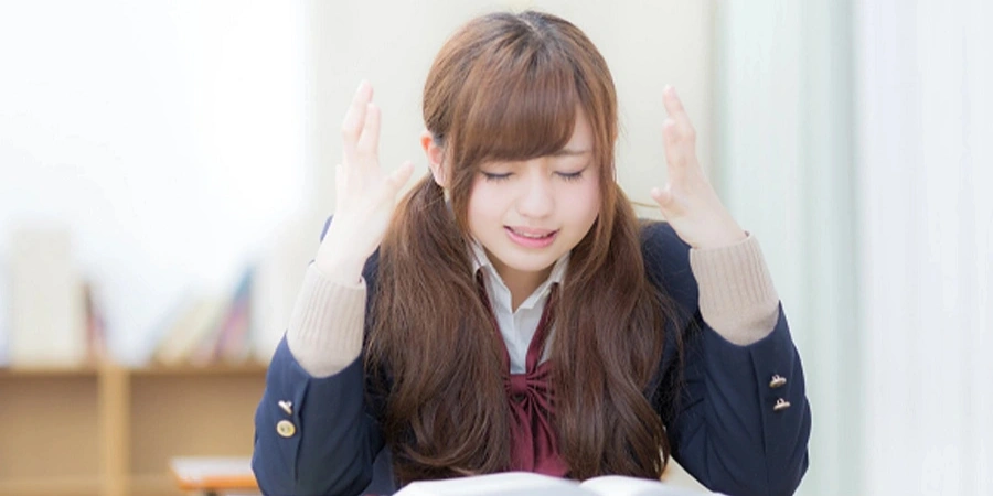 Anxious Japanese student during the exam