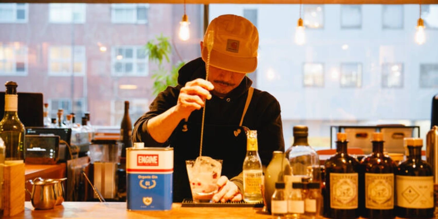 Bartender mixing drinks at Forrester Bar & Kitchen in Nakameguro
