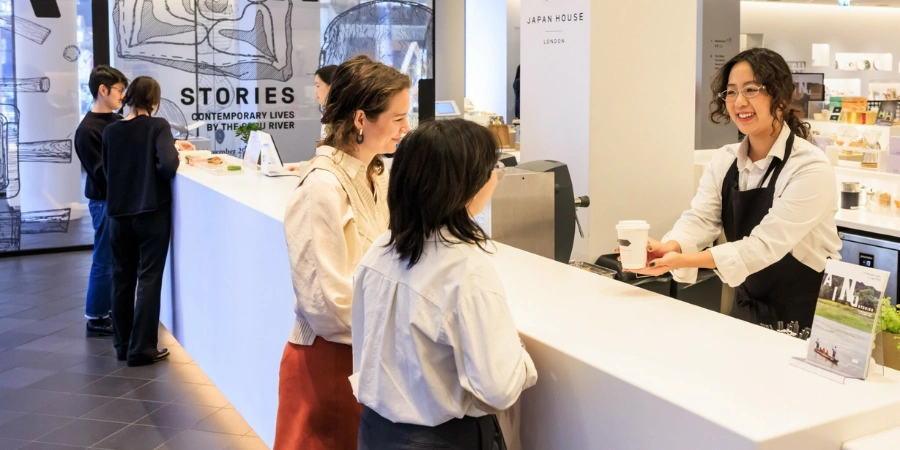 Two women ordering at the female barista in The Stand cafe
