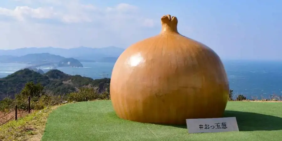 Giant onion sculpture overlooking the ocean