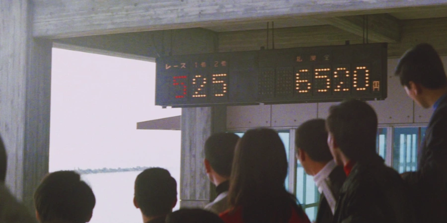 Japanese people checking the issues if a flight is cancelled on the prompter
