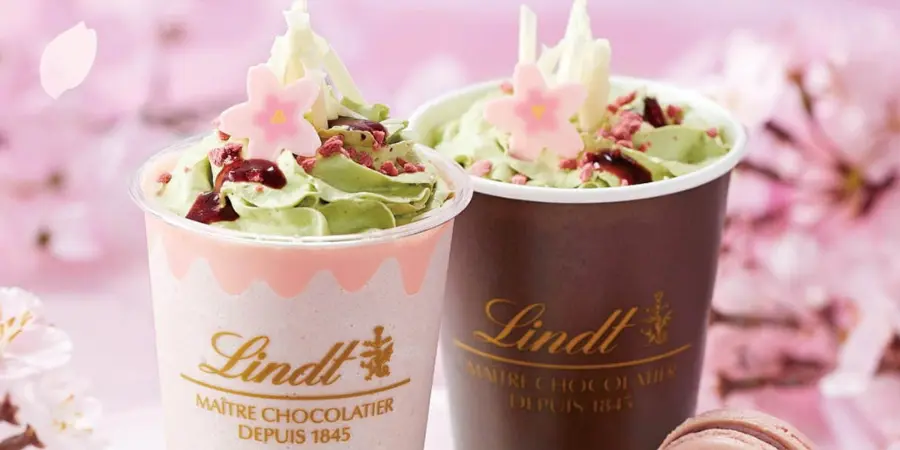 Two cold drinks from Lindt Chocolatier that consists of pistacho, chocolate, and cherry blossoms.