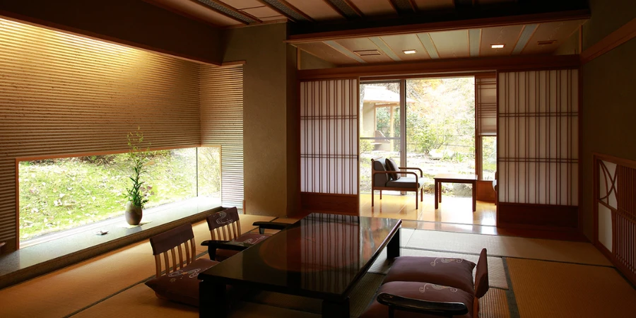 Tatami guest room at Senjuan in Tanigawa Onsen with a low table, sunken seating and a large window onto the trees