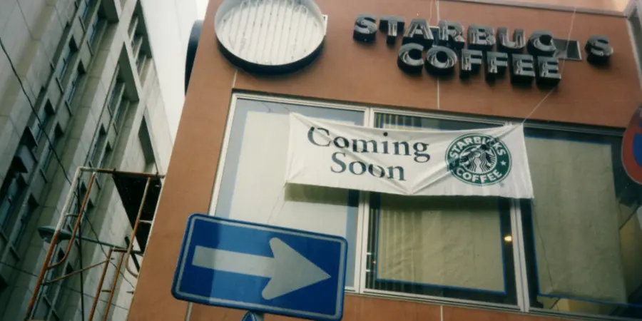 Coming soon sign posted on the first Starbucks to open in Japan