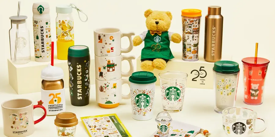 Starbucks bear-themed merchandise, including mugs, tumblers, and a plushie