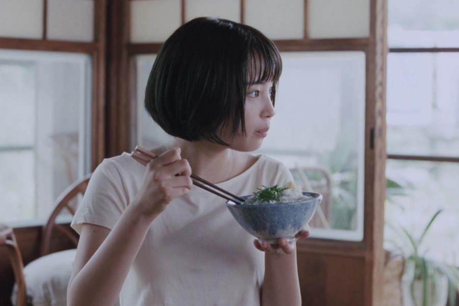 a young healthy Japanese woman eating healthy Japanese food