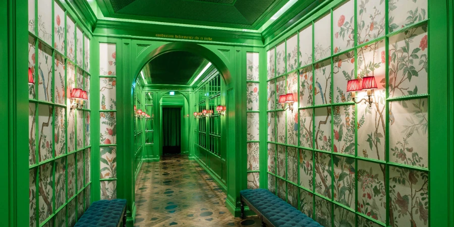 Green corridor with botanical wallpapers in the Gucci restaurant in Tokyo