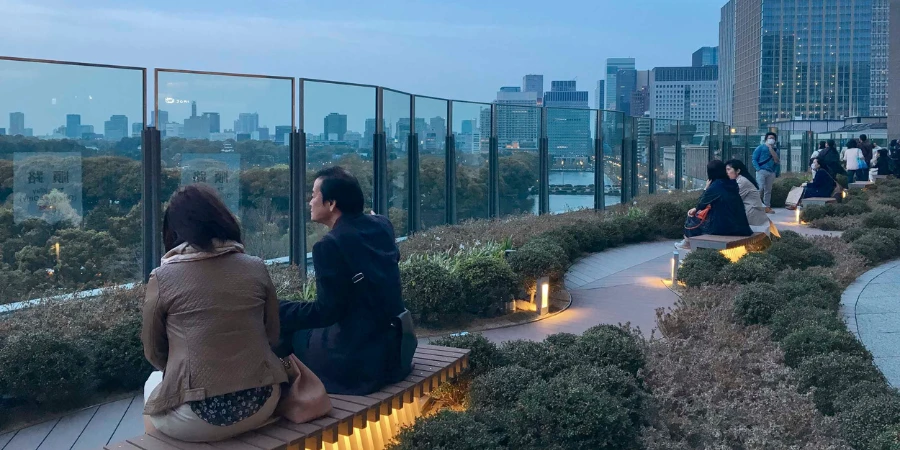 People sitting on a rooftop garden