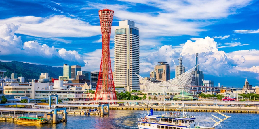 A boat and a red tower at Kobe Harborland