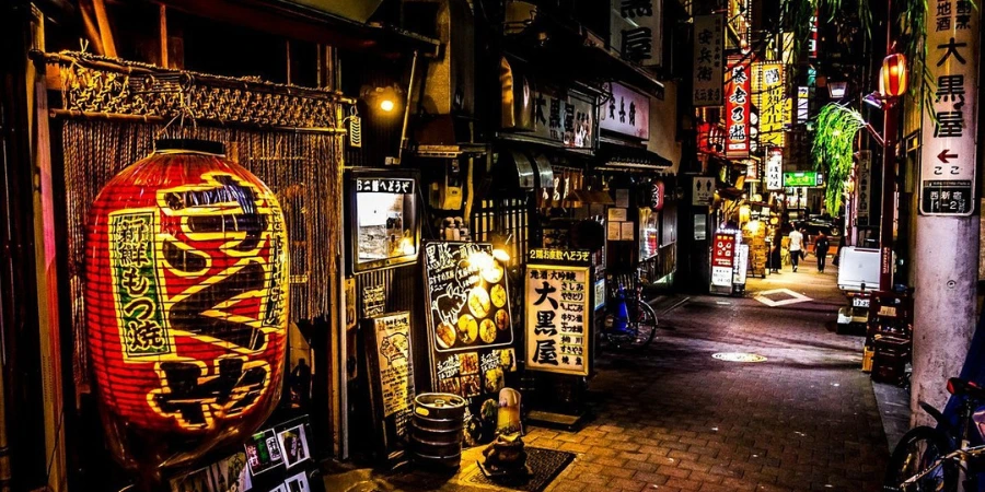 Omoide Yokocho at night, with bright signages of restaurants and shops