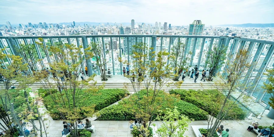 People in Abeno Harukas rooftop garden with trees
