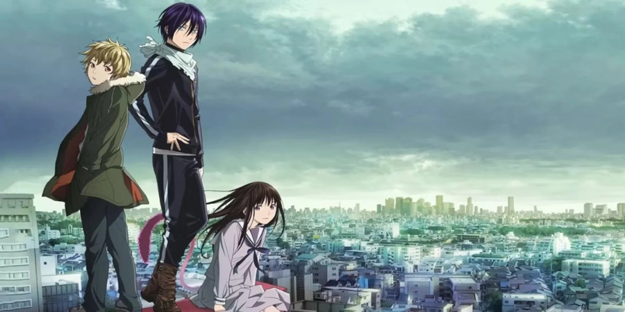 Yato, Hiyori, and Yukine overlooking a city skyline in Noragami, supernatural anime featuring gods, spirits, and modern urban fantasy setting.