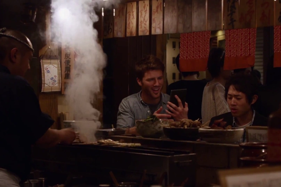 eating in a local cheap restaurant in tokyo with your friend when on vacation, sitting in front of the chef