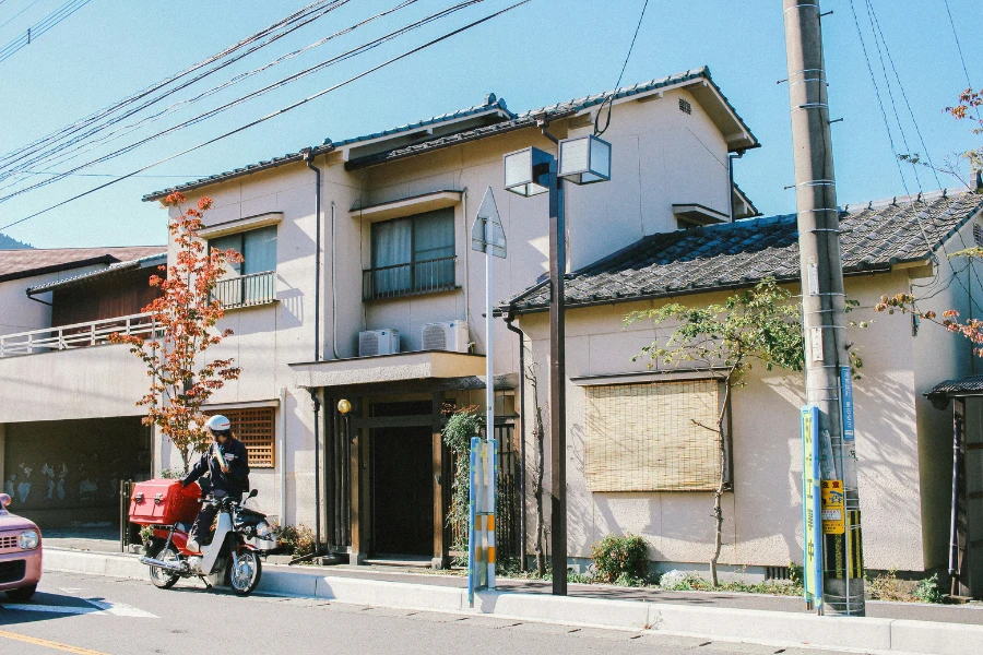 A house in Japan with a rider and his motorcycle