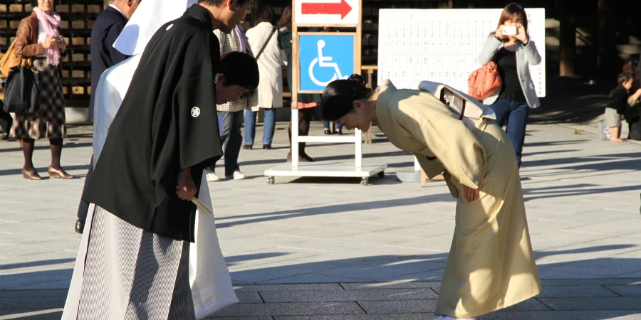 Japanese Bowing at each other in traditional clothing