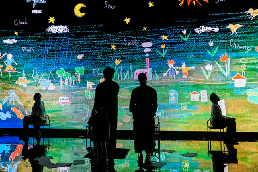 Shotaro's drawings projected on screen for Japanese-English adapted production Our Cosmic Dust