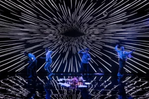 Our Cosmic Dust on stage with lights and illuminations and actors