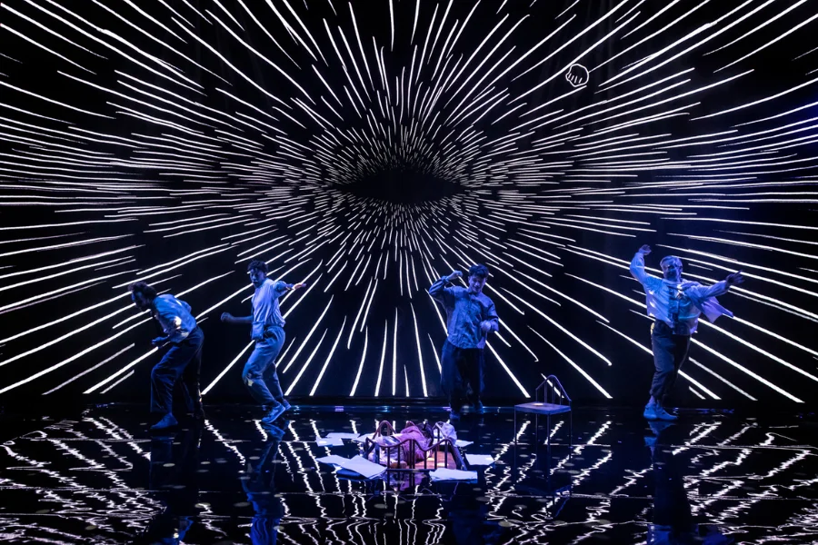Our Cosmic Dust on stage with lights and illuminations and actors