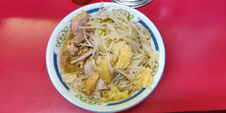 Ramen topped with bean sprouts and garlic