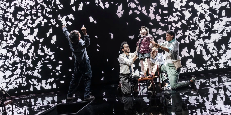 paper sculptures fluttering away during a climactic scene in Our Cosmic Dust