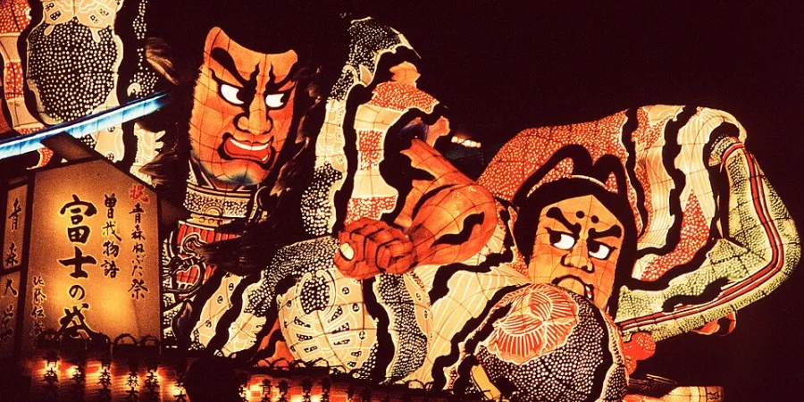 Giant illuminated Nebuta warrior float at Aomori Nebuta Matsuri in Aomori, Japan, showcasing traditional Japanese lantern festival craftsmanship.