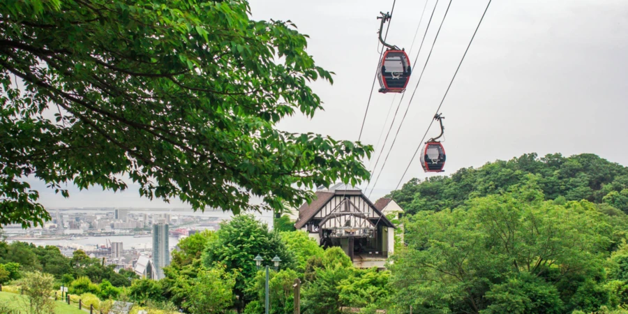 Cablecars in motion through the Nunobiki Herb Garden in Kobe, Japan
