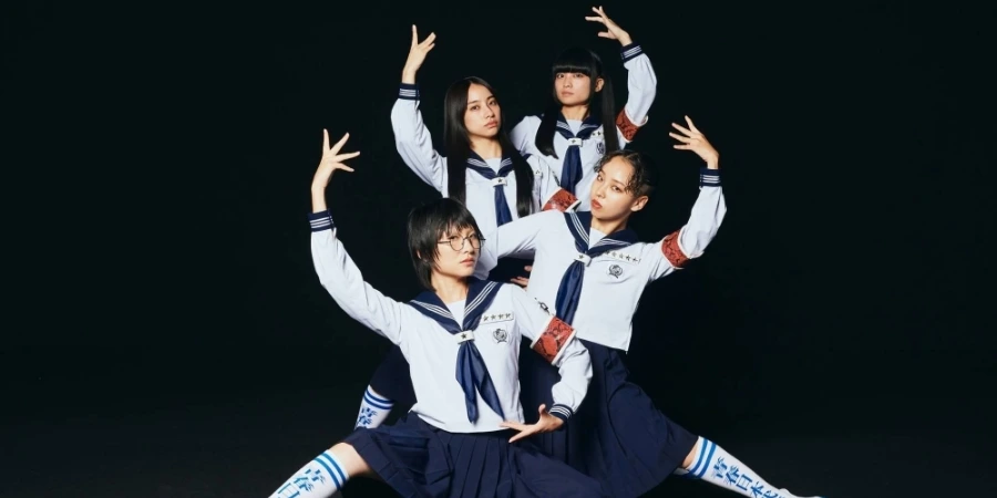4 members of J-pop girl group Atarashi Gakko in a group pose