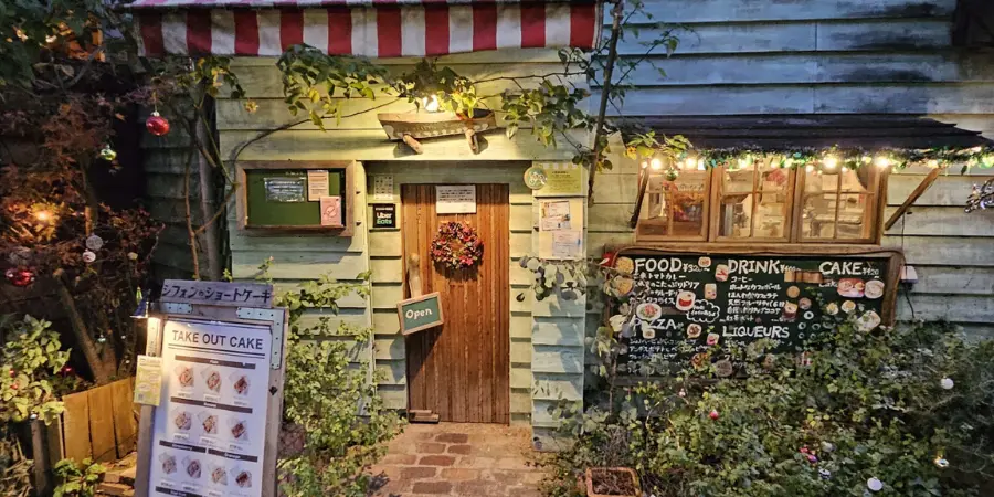 The entrance exterior of Hattifnat Cafe. It resembles a Studio Ghibli home with a lot of forest motifs.