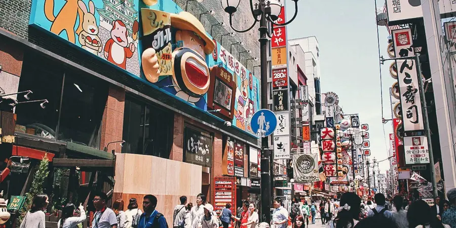 An outside street of Namba with colorful billboards and signs