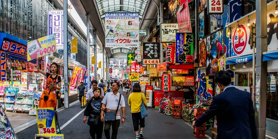 Shopgoers walk through a shopping arcade in Shinsaibashi district