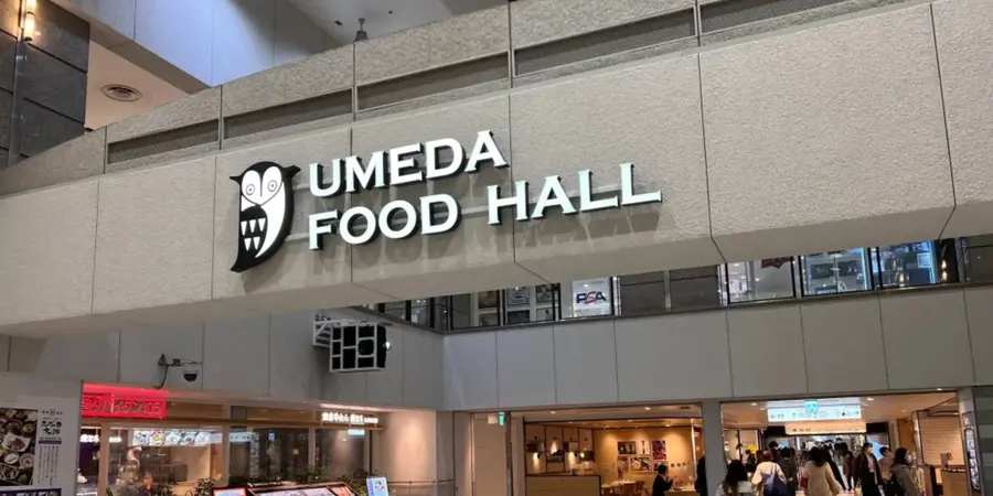 The interior of a food court with a signage that says "Umeda Food Hall"
