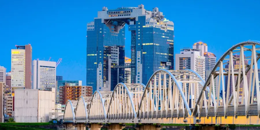 A landscape image of the tall and modern skyscrapers of Umeda district, including the Umeda Sky Building