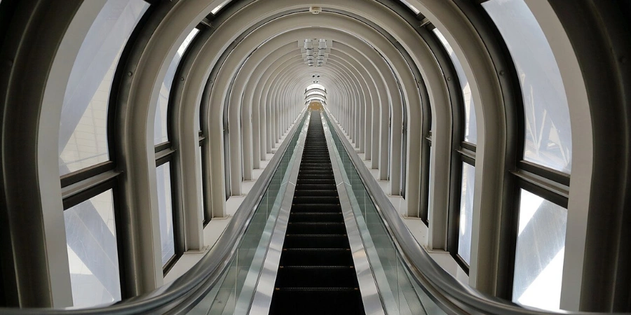 A view of the escalator with glass windows at Umeda Sky Building